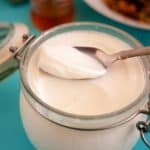A glass jar with Greek Yogurt homemade.