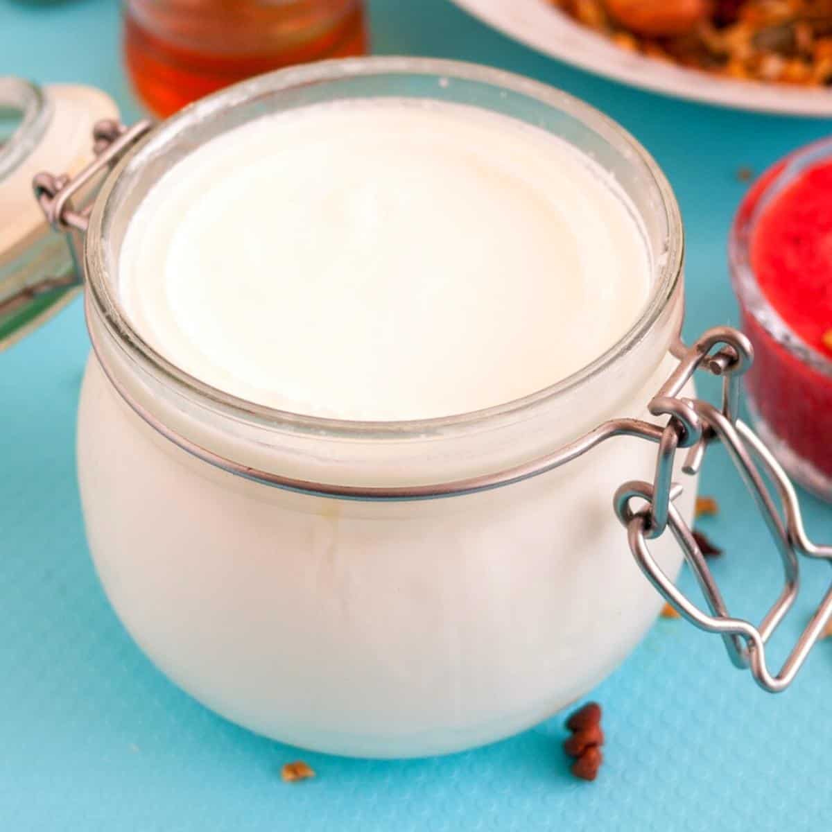 Fresh homemade yogurt in a mason jar.