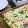 A casserole of beef and potatoes in a baking dish.
