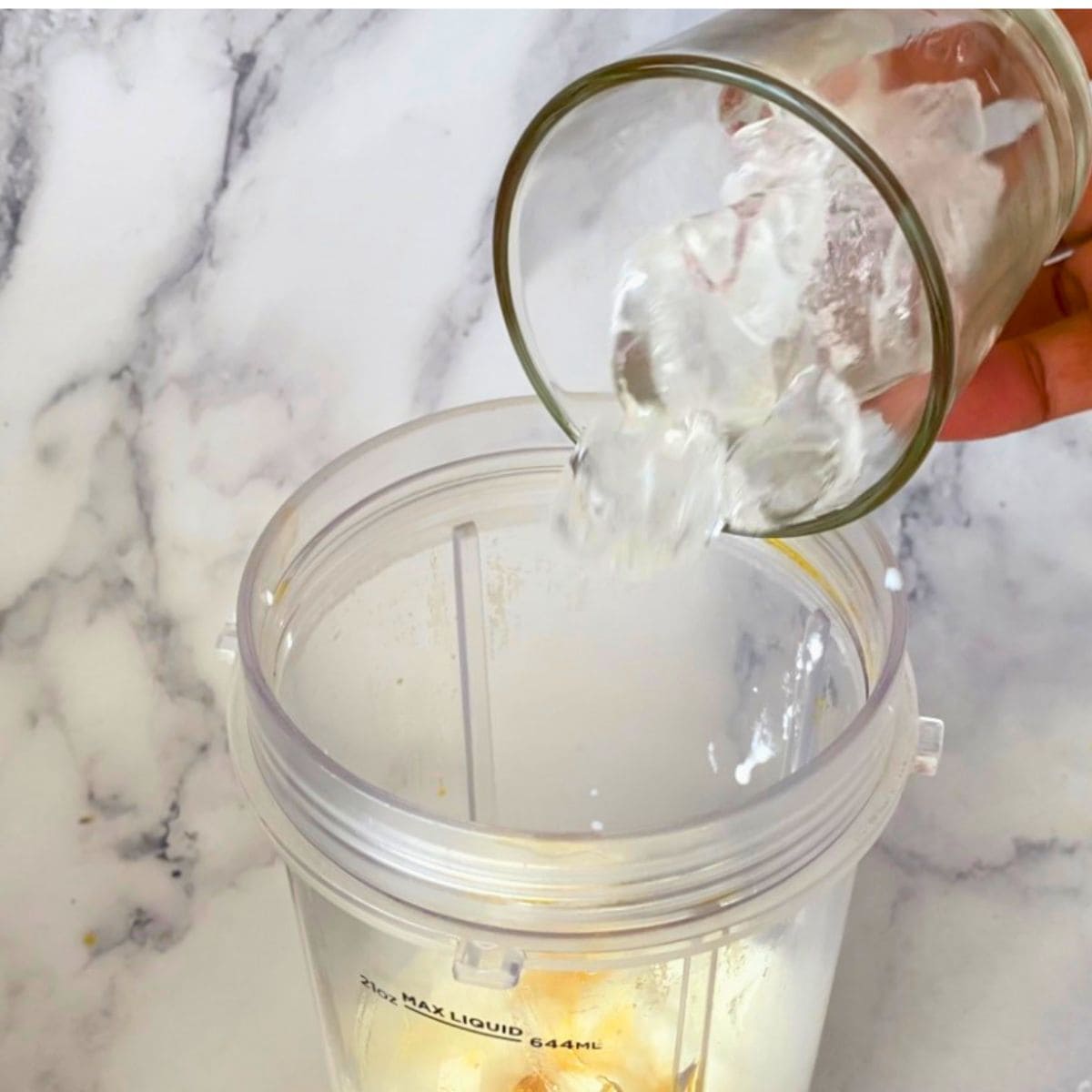 Adding Ice to the blender.