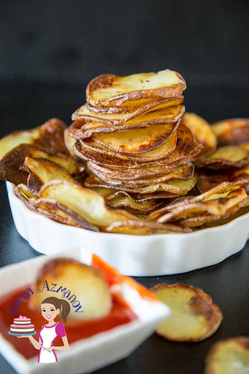 A plate with oven baked potato chips.