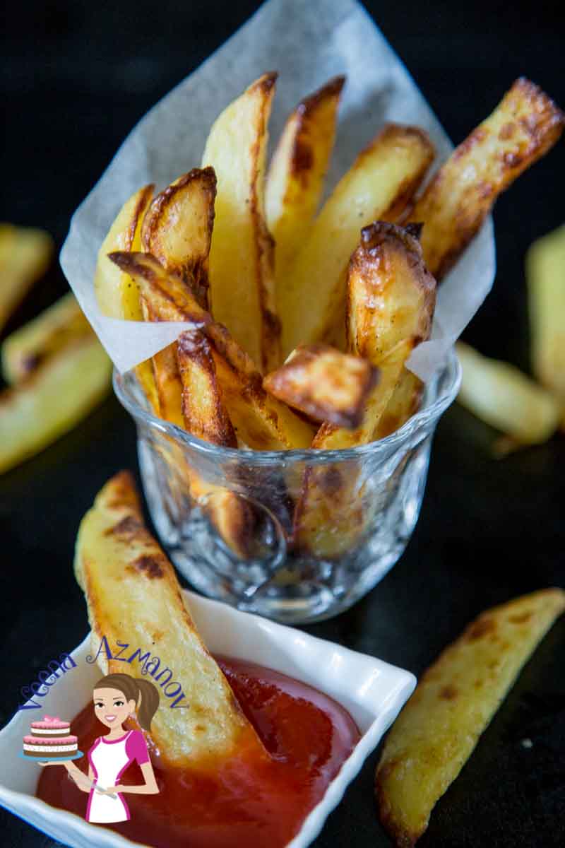 A glass with potato wedges.