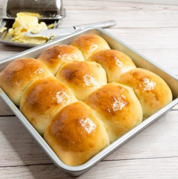 Baked rolls in a pan brushed with butter