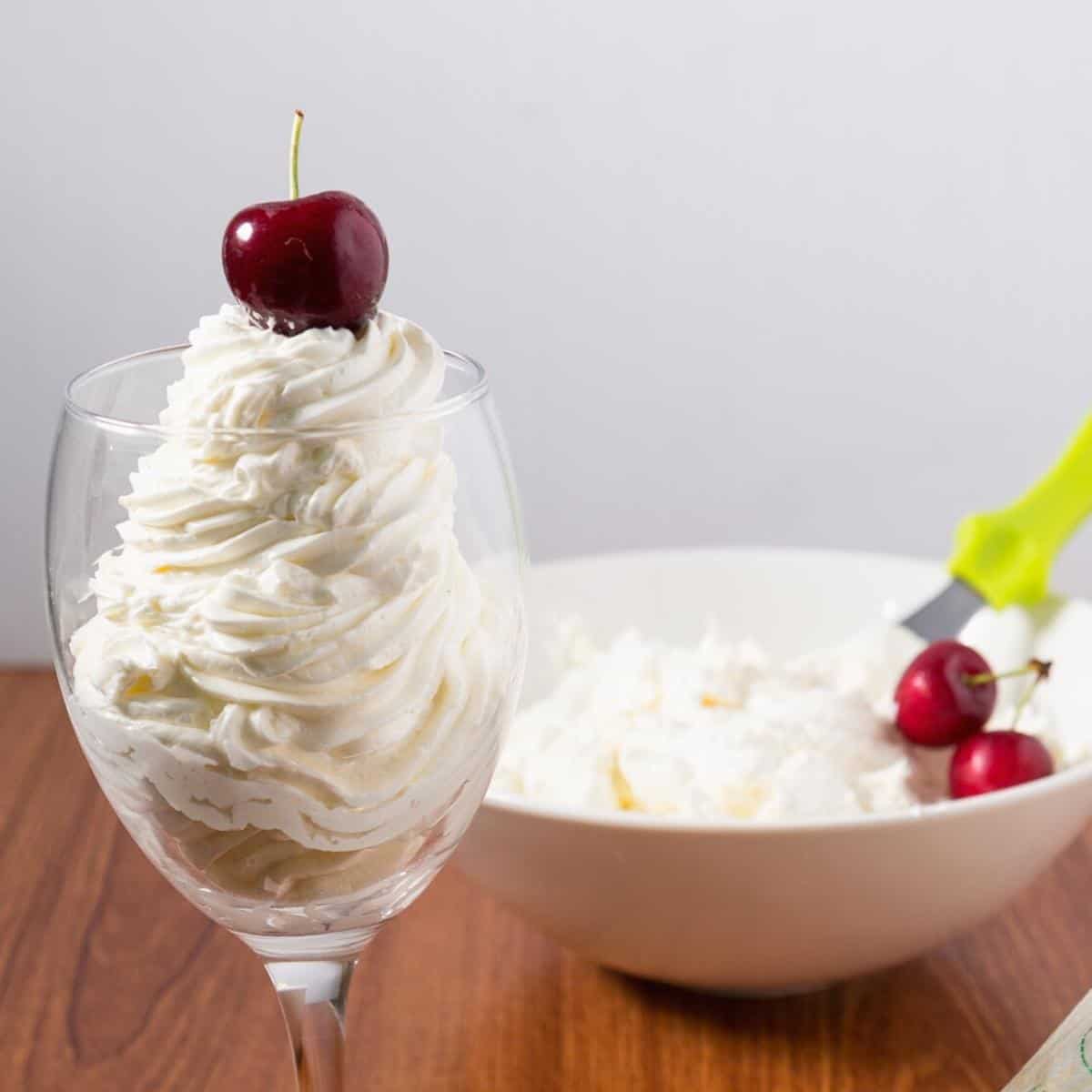 A wine glass with Swiss Meringue Buttercream Frosting.