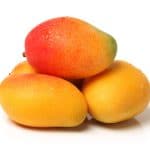 Fresh mangoes on the table.