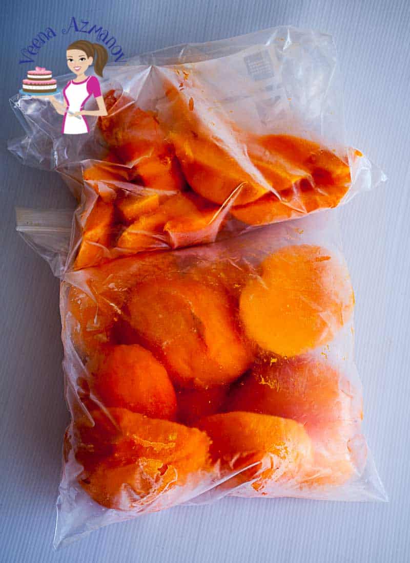A plastic bag filled with slices of mango.