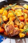 Roasted chicken and vegetables in a skillet.