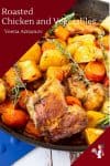 Roasted chicken, potatoes and vegetables in a skillet.