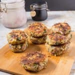 A wooden board with tuna fish patties