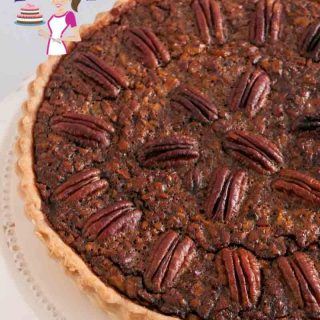 This is a delicious and beautiful classic Pecan Pie. Soften creamy filling made with golden syrup, brown sugar and whipping cream then baked into a homemade flaky pie crust. Just one bite will send your taste buds singing.