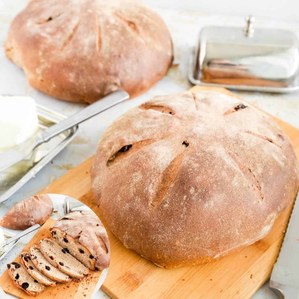Whole Wheat bread and sliced raisin bread on a wooden board. 