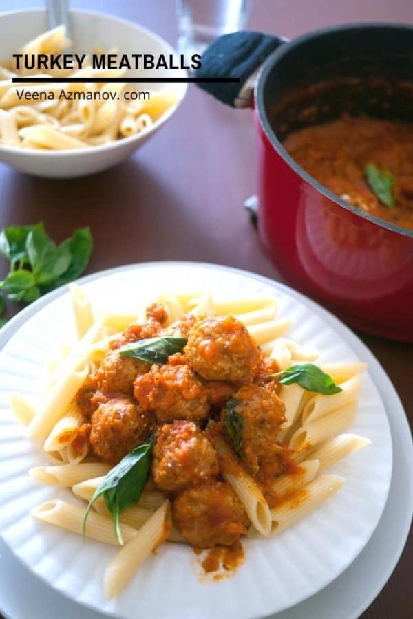 A plate of turkey meatballs with penne pasta.