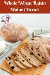 A sliced whole wheat bread with raisins and walnuts.