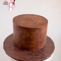A cake decorated with chocolate ganache.