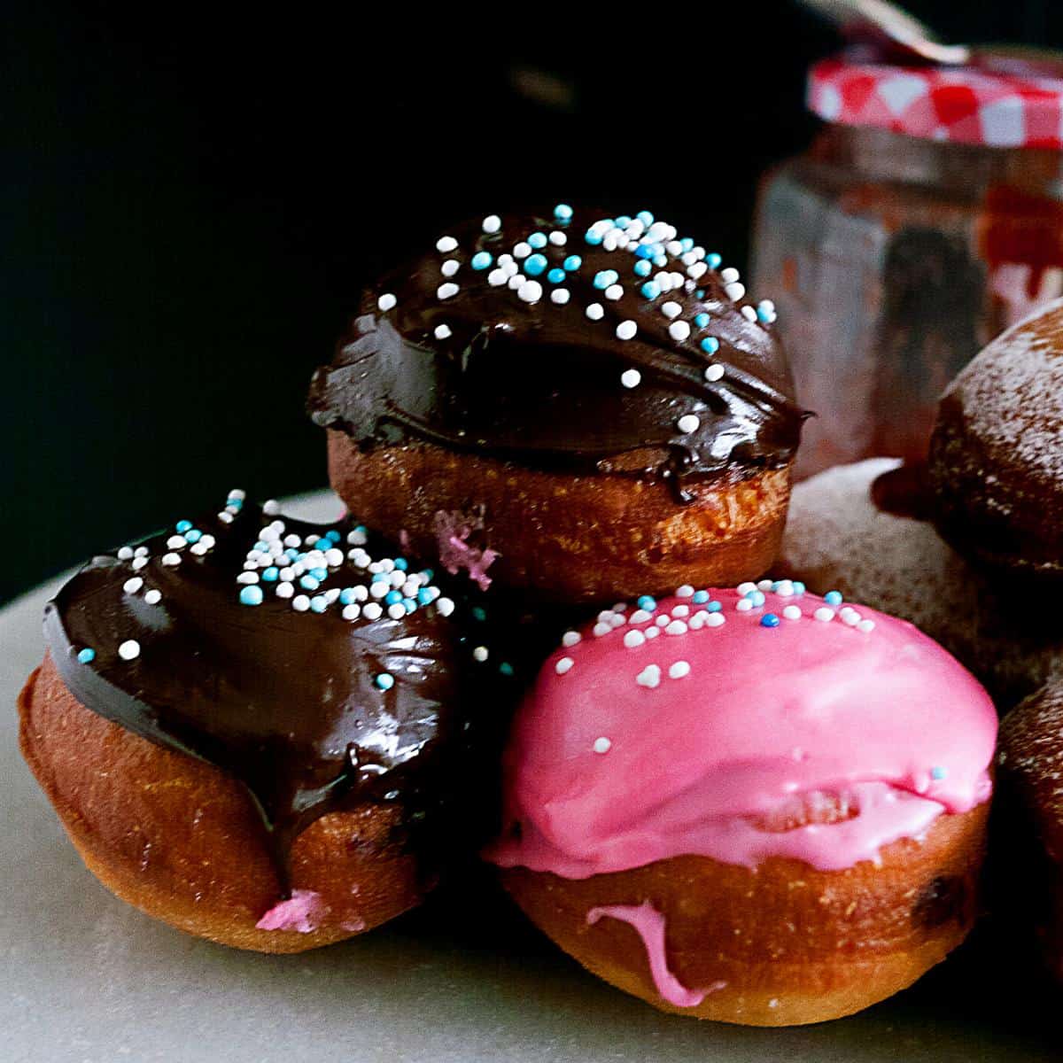 Chocolate sufganiyot doughnuts on the table.