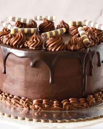 A chocolate cake with chocolate decorations.