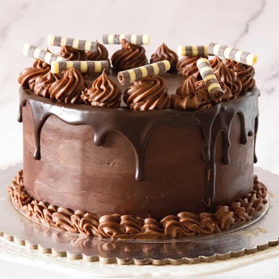 A chocolate cake with chocolate decorations.