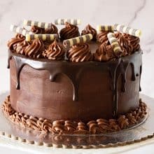 A chocolate cake with chocolate drip.