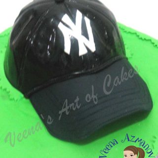A cake decorated to look like a New York Yankees baseball cap.