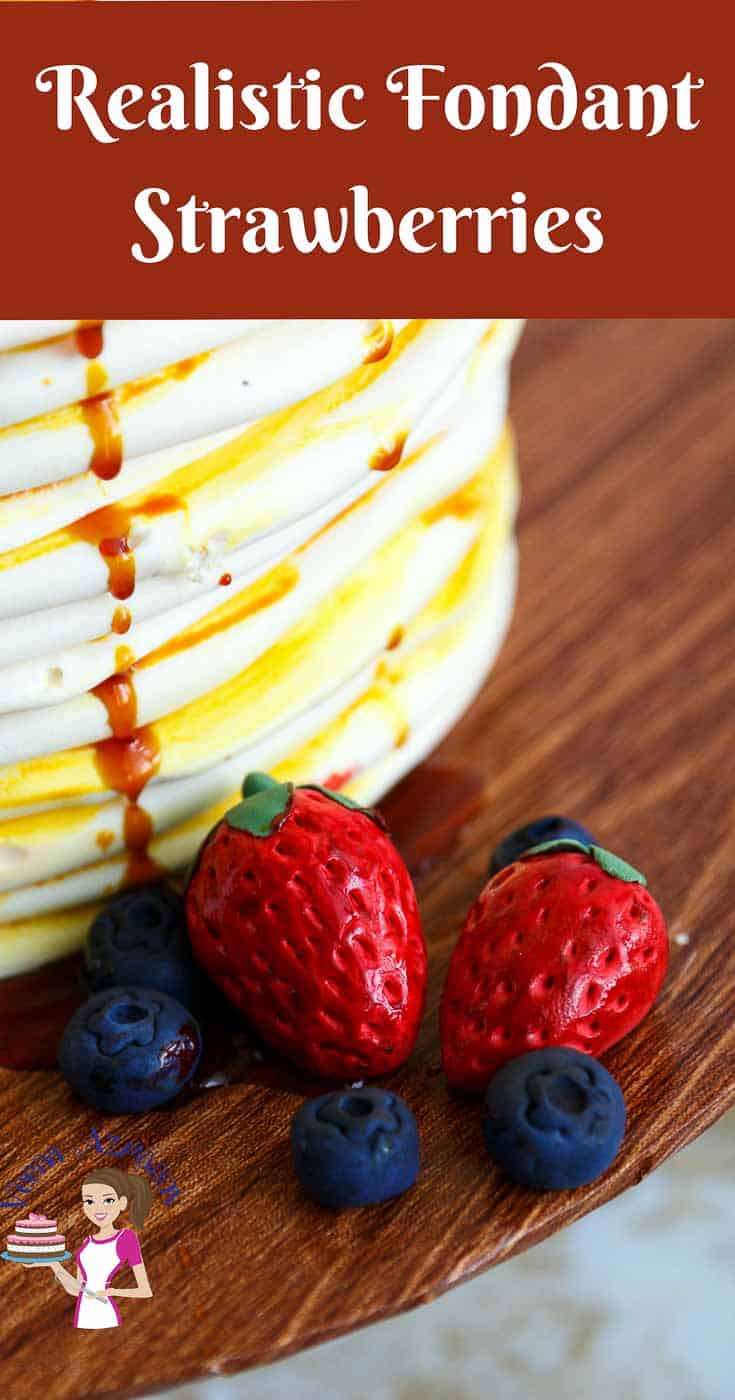 A close up of a cake decorated like a stack of pancakes.