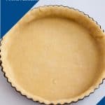 An unbaked tart crust in a tart pan.