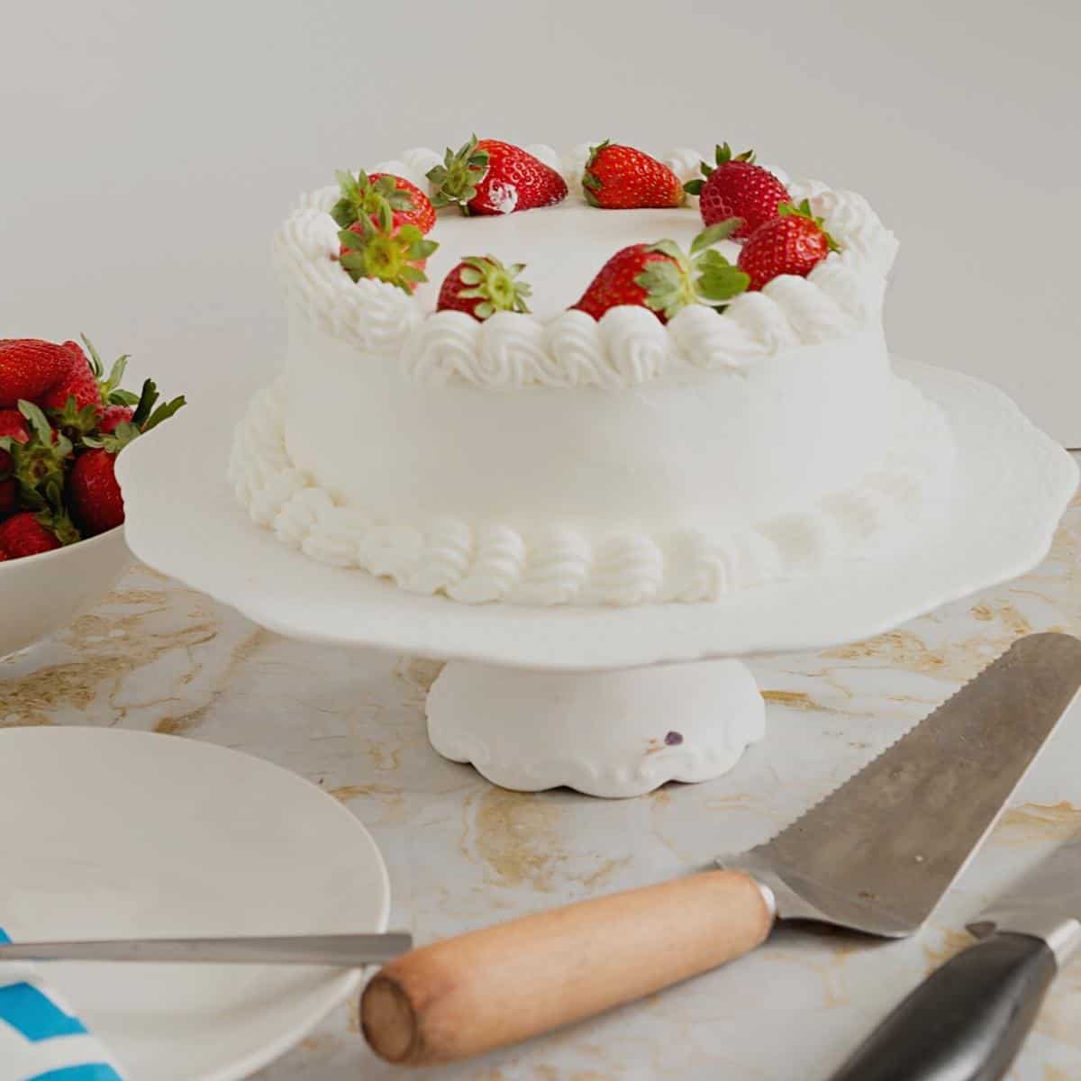 A whip cream frosted cake.