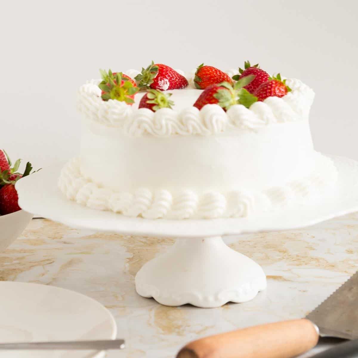 A whipped cream frosted genoise cake.