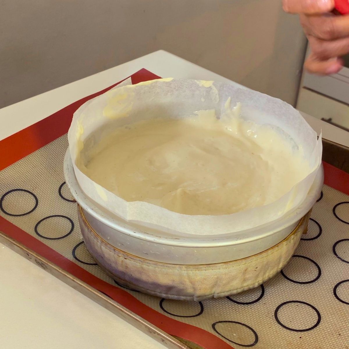 Sponge cake batter in baking pan.