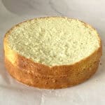 Two layers of Genoise sponge on the table.