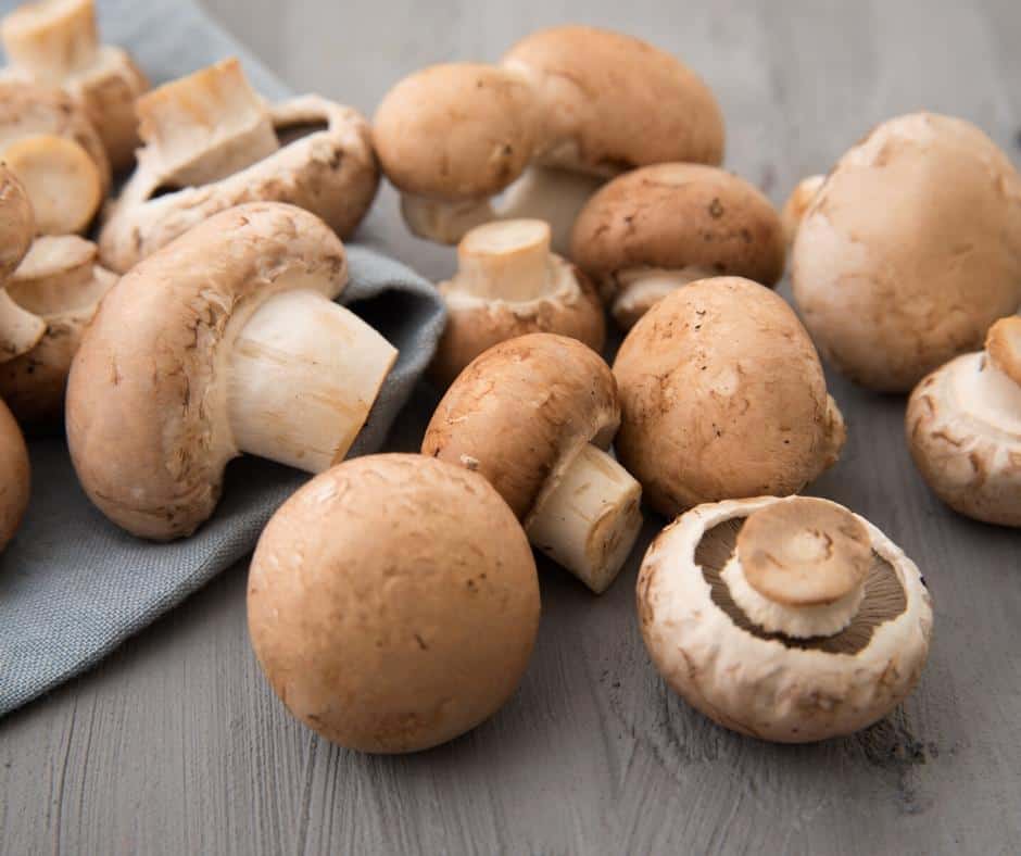 Champignon mushrooms on a table.