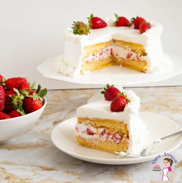 A slice and cake of strawberry cake