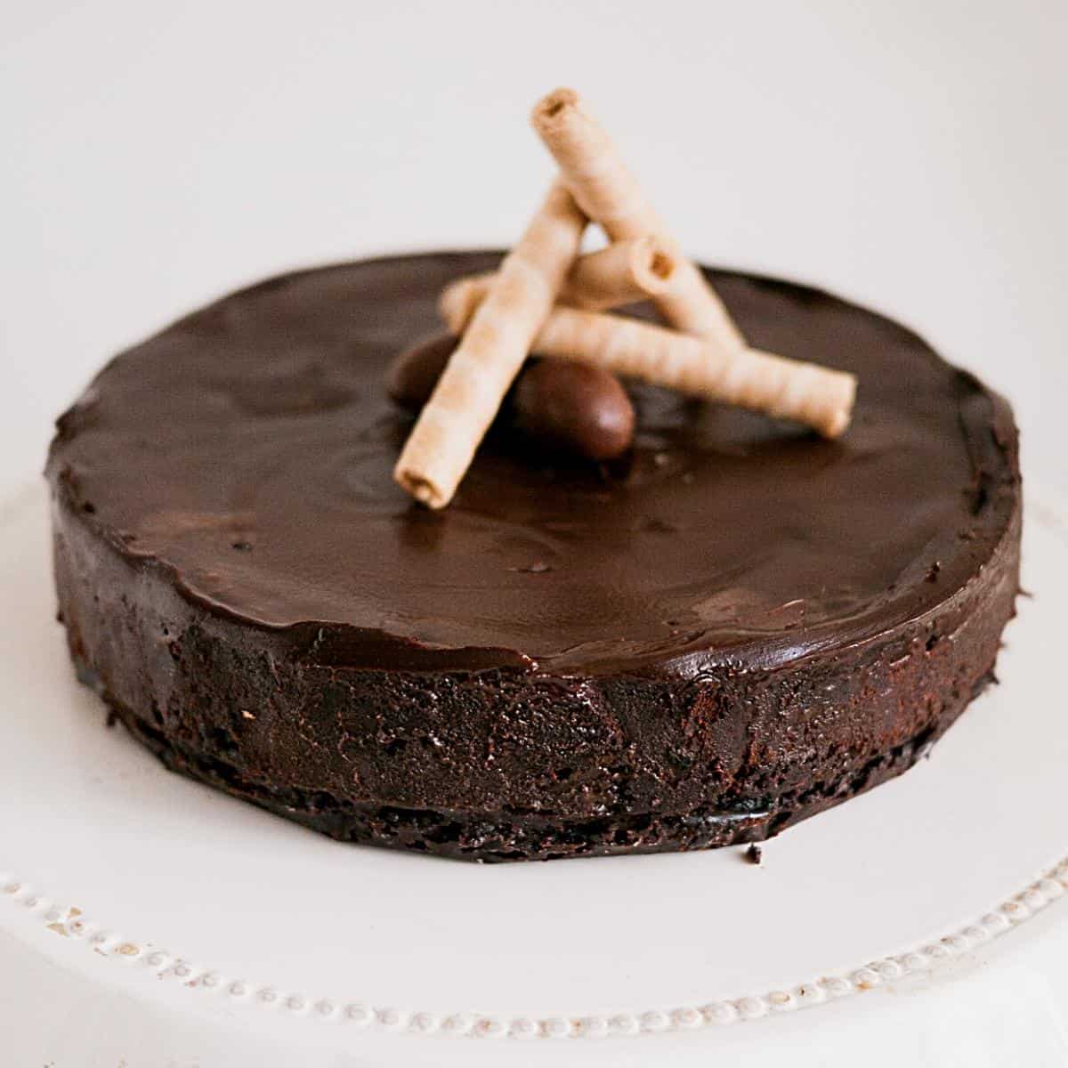 Chocolate cake - flourless topped with wafers.