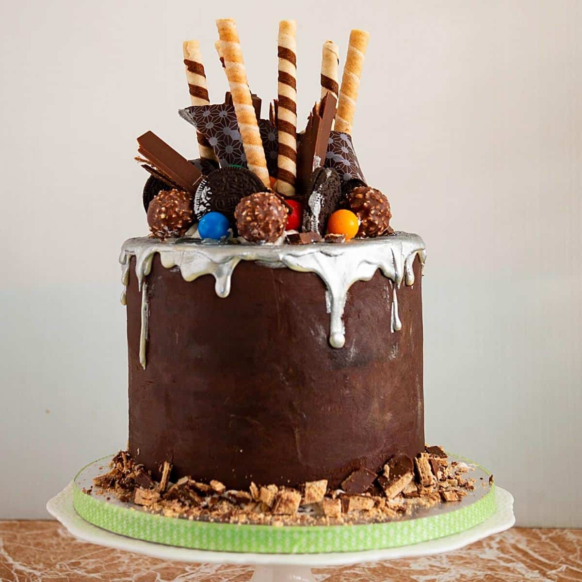 A ganache cake with chocolate ganache drip.