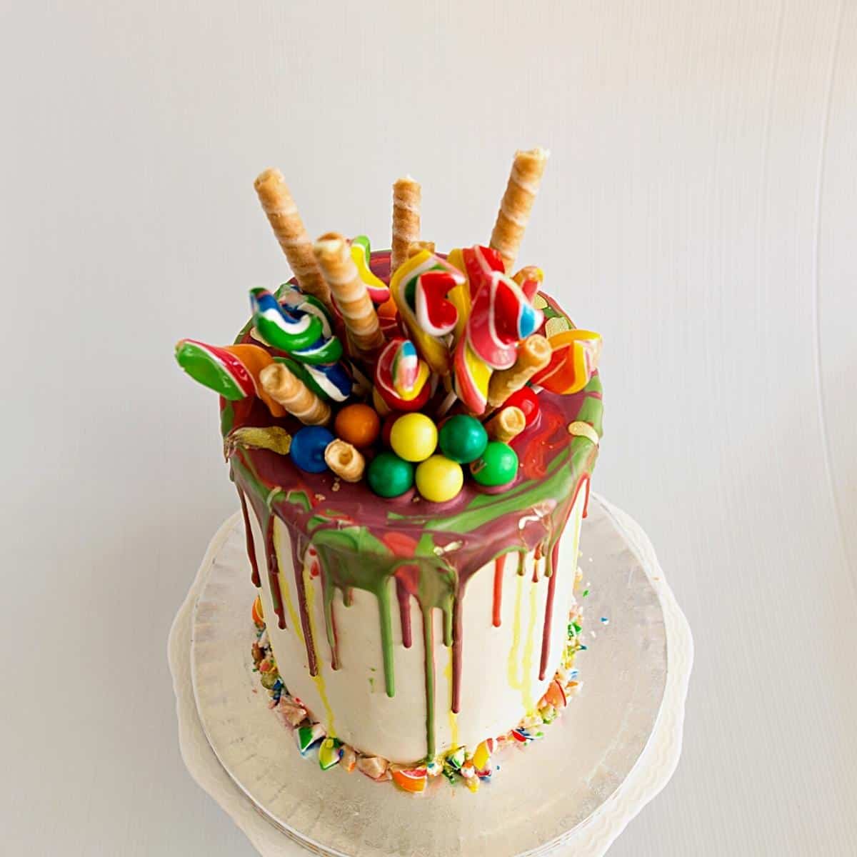 Rainbow cake with ganache drip.