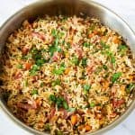 A skillet with fried rice.