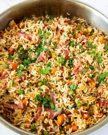 A skillet with fried rice.