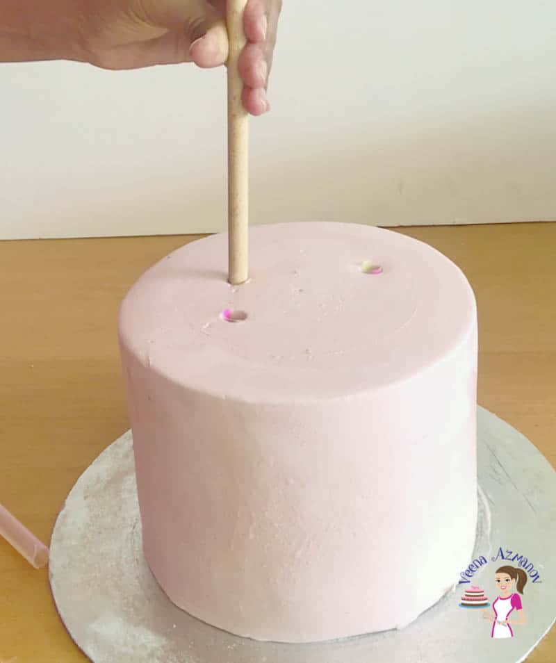 How do you dowel a cake correctly before stacking it