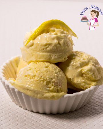 4 scoops of lemon ice cream in a bowl.