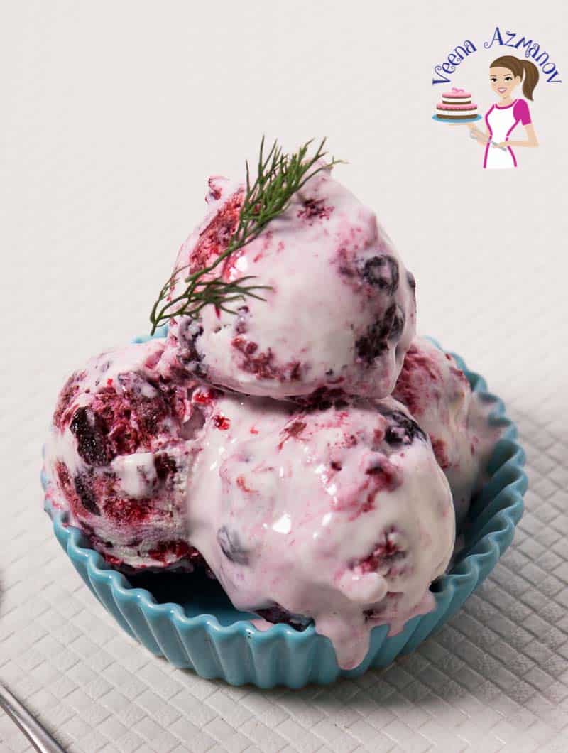 4 scoops of mixed-berries ice cream in a bowl.