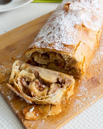 A sliced apple strudel on the table.
