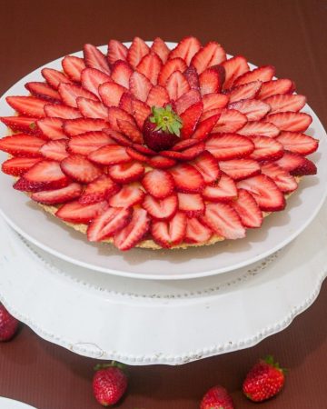 A fruit tart on a cake stand