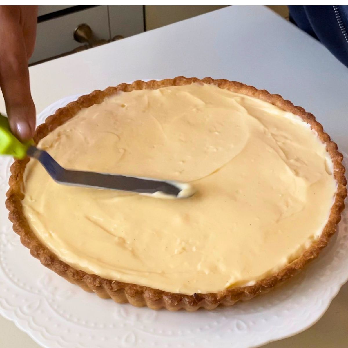 A pastry shell with pastry cream.