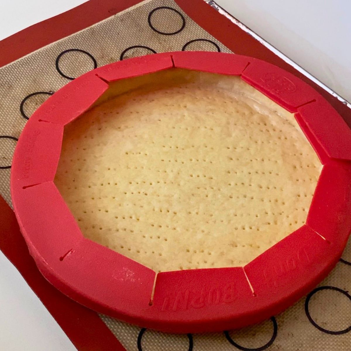 Baking the tart shell with tart shield.