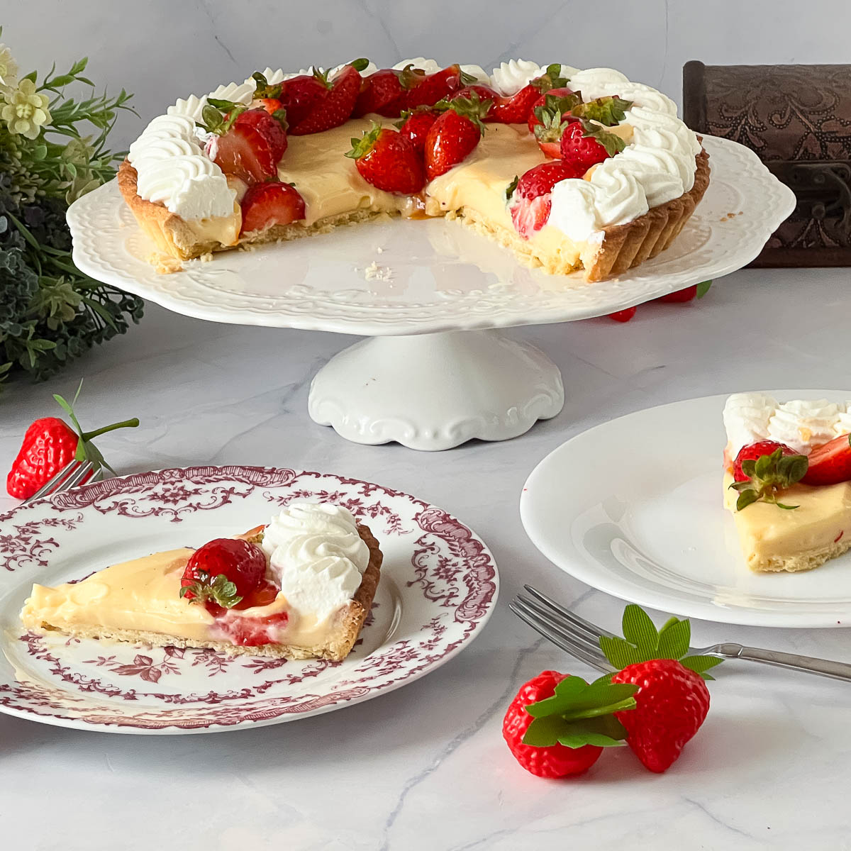 A sliced tart with pastry cream and whipped cream.
