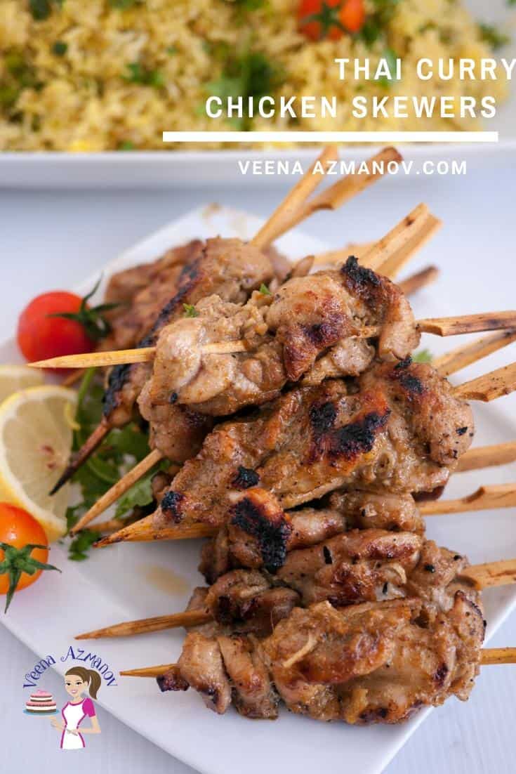 A stack of Thai chicken skewers on a plate.
