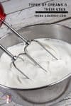 Whipping cream in a stand mixer.