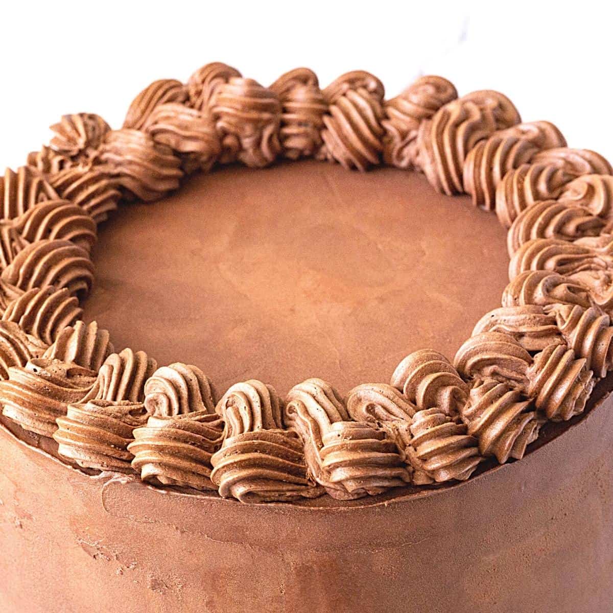 A cake frosted with ganache.