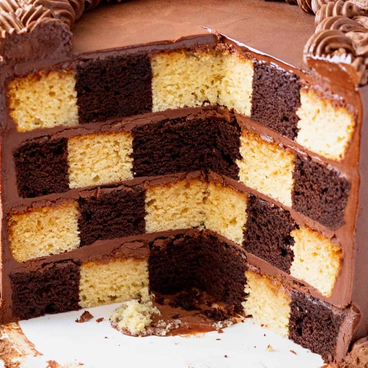 A checkerboard cake on the table.
