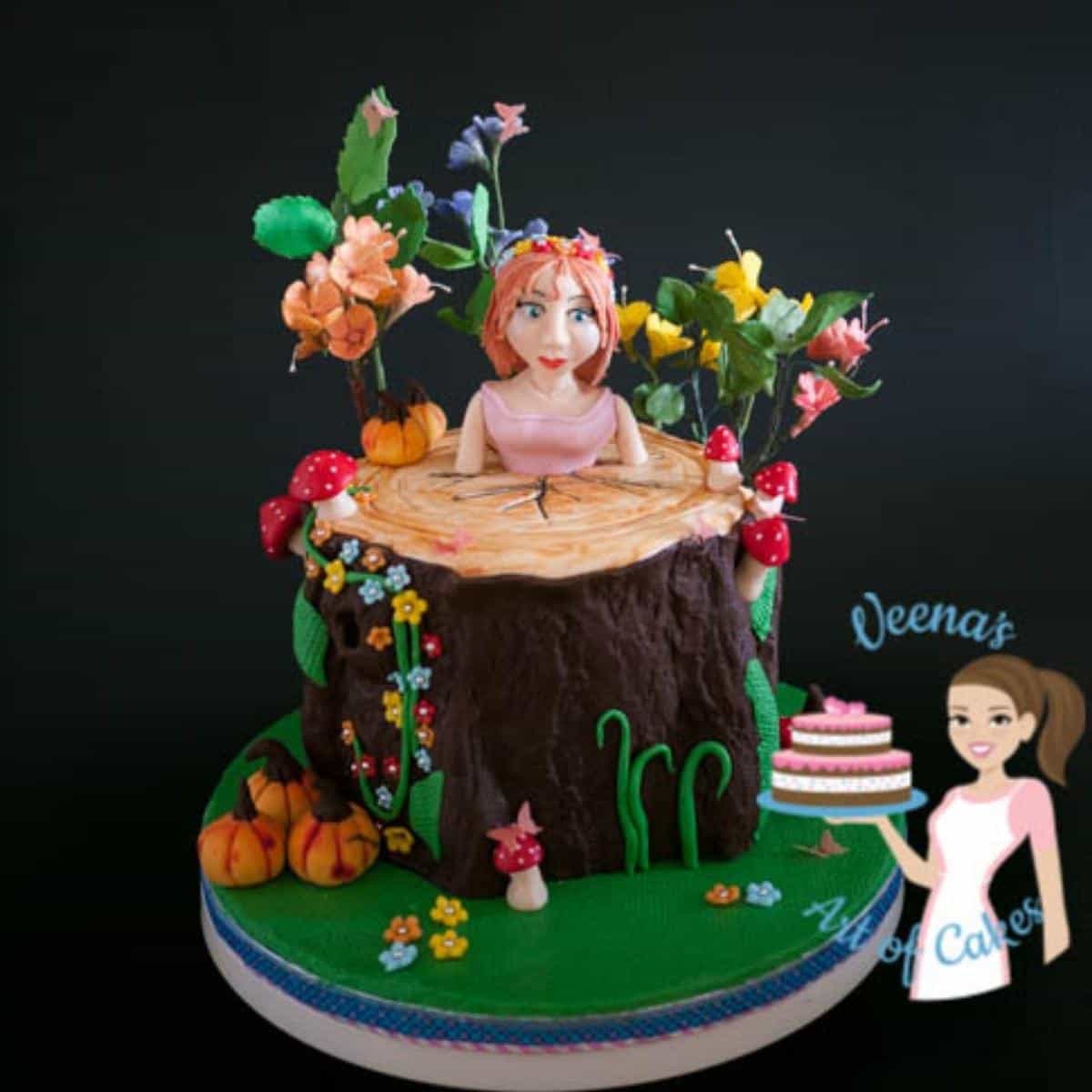 Enchanted forest cake with a girl made from modeling chocolate.
