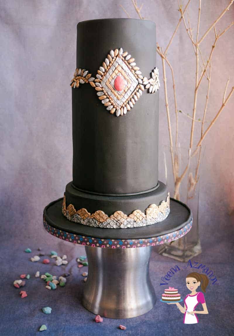 A decorated cake on a cake stand.
